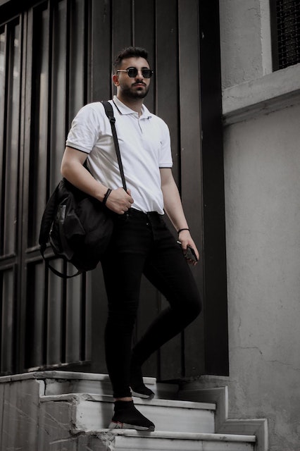 white polo shirt with skinny black jeans